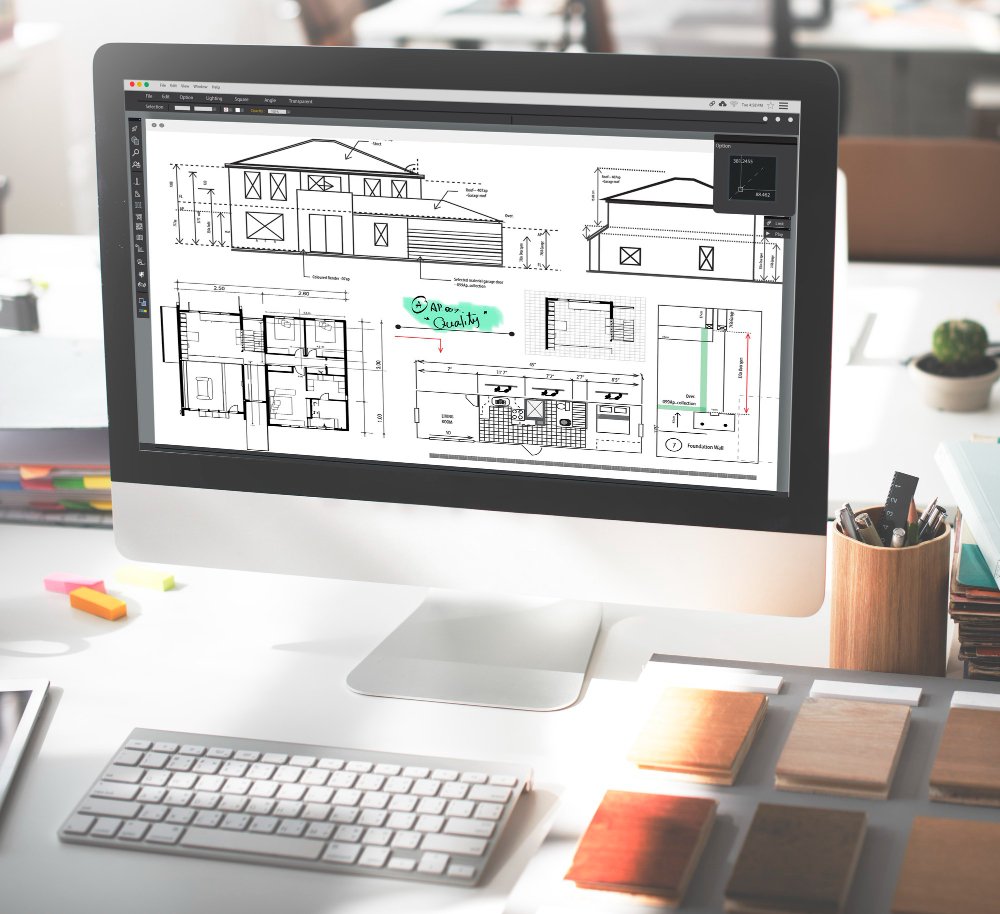 Architectural design drawings and floor plans displayed on a digital workstation for project planning.